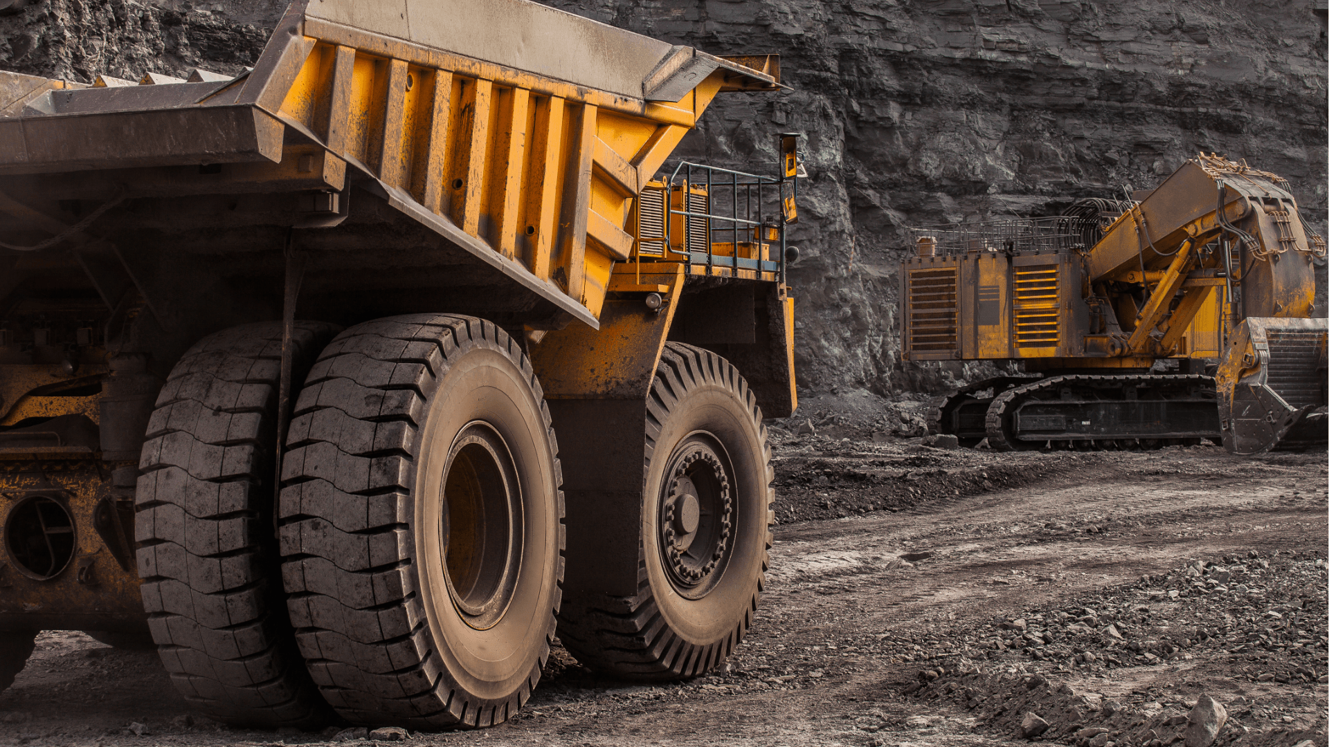 Two yellow hauling trucks driving at a safe distance, representing transportation safety and compliance